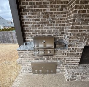 Outdoor kitchen with built-in grill installation in Shelby County
